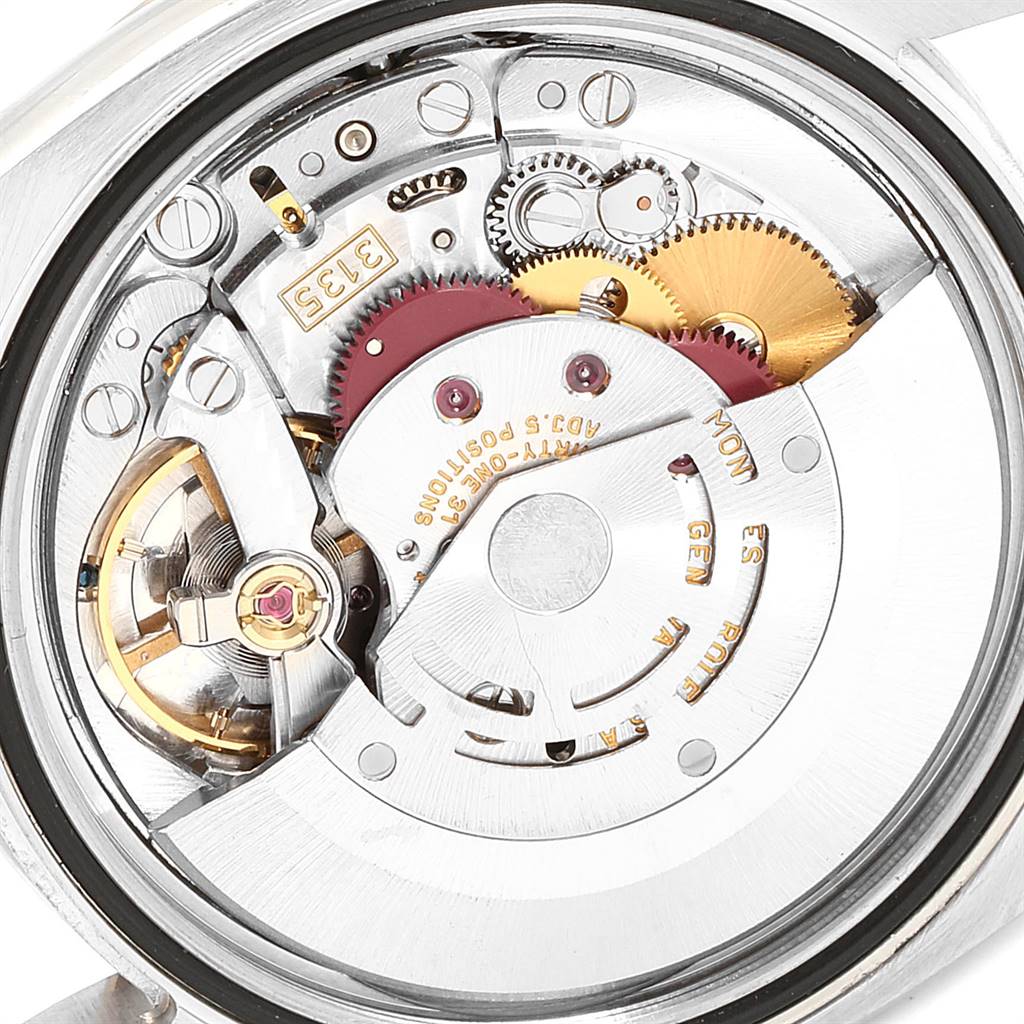 The image shows the internal mechanical movement of a Rolex Turn-o-Graph 116264 Men
s Stainless Steel White Dial 116264 Men
s Stainless Steel White Dial watch, highlighting gears and components in close-up detail.