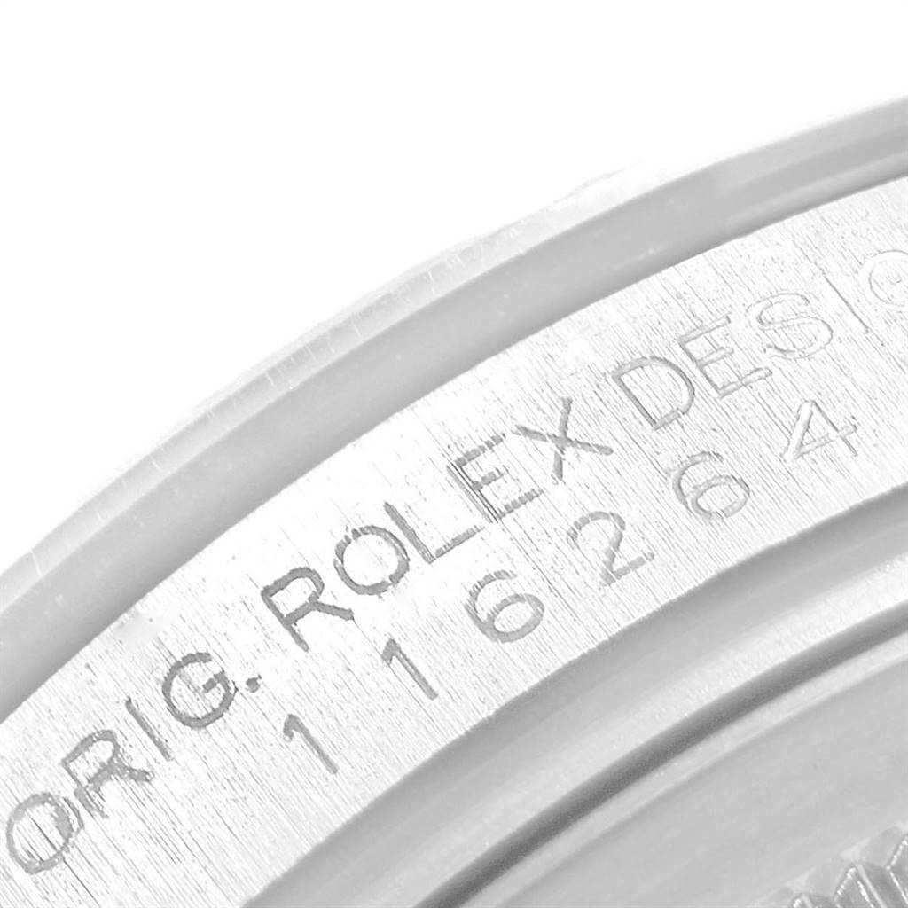 This image shows a close-up of the engraved bezel on a Rolex Turn-o-Graph 116264 Men
s Stainless Steel White Dial 116264 Men
s Stainless Steel White Dial watch.