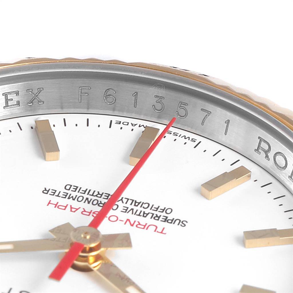 This close-up photo of the Rolex Turn-o-Graph 116263 Men
s Stainless Steel White Dial 116263 Men
s Stainless Steel White Dial model watch shows the dial, hands, and serial number on the bezel.