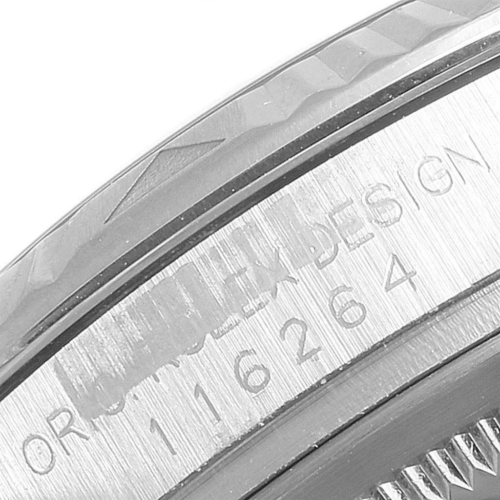 This close-up image shows the engraved bezel and serial number of a Rolex Turn-o-Graph 116264 Men's Stainless Steel Black Dial 116264 Men's Stainless Steel Black Dial watch.