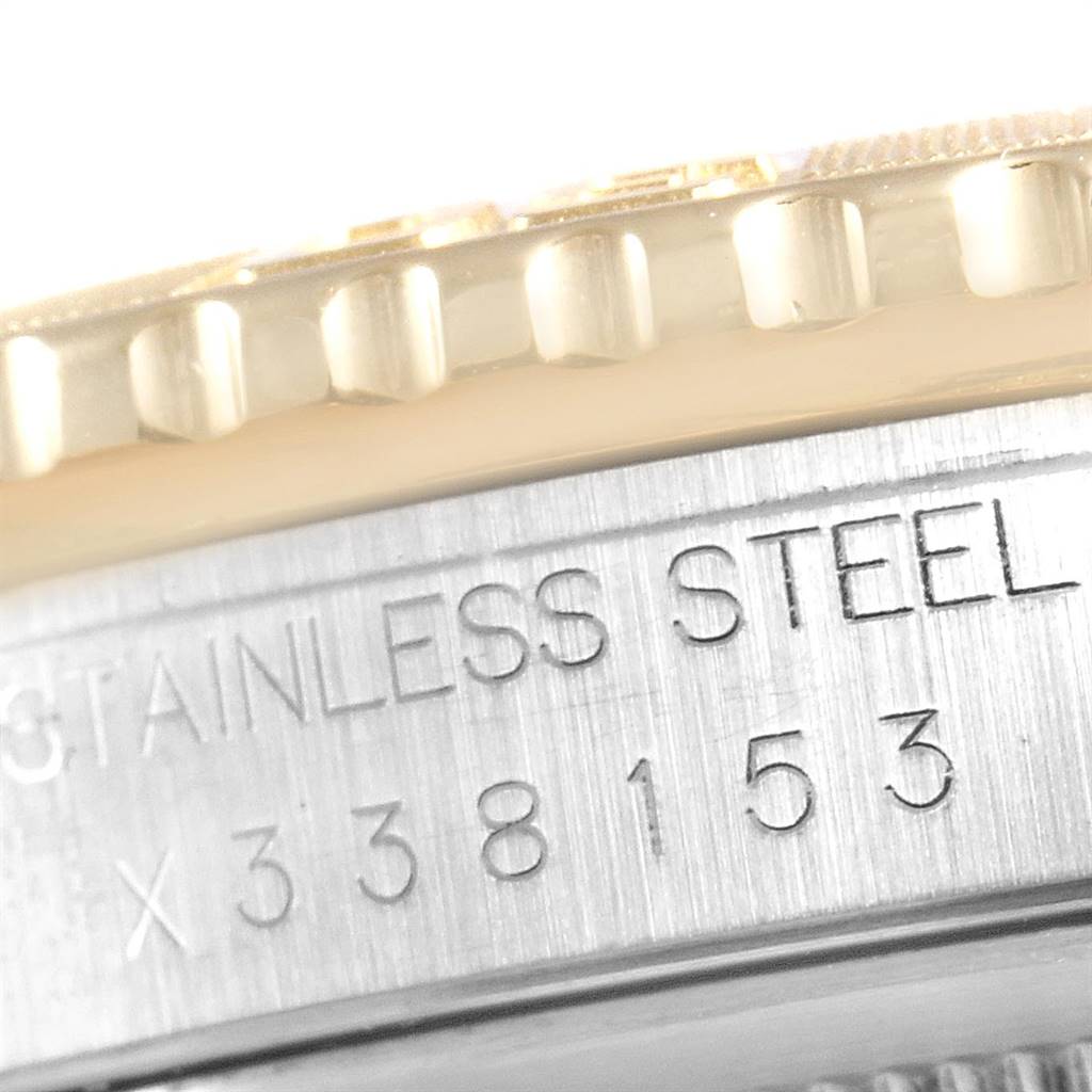 The image shows a close-up of the bezel and the engraved stainless steel case of a Rolex Turn-o-Graph 16263 Men
s Steel and Gold (two tone) Blue Dial 16263 Men
s Steel and Gold (two tone) Blue Dial model.