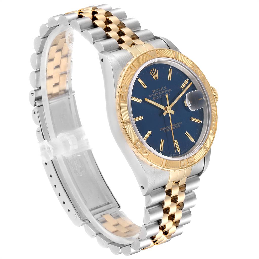 The Rolex Turn-o-Graph 16263 Men
s Steel and Gold (two tone) Blue Dial 16263 Men
s Steel and Gold (two tone) Blue Dial watch is shown at an angle highlighting its gold bezel, blue dial, and two-tone metal bracelet.