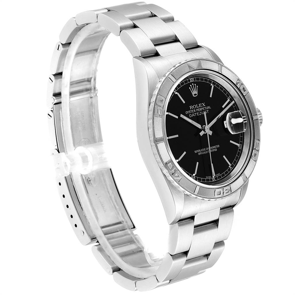 The image shows a Rolex Turn-o-Graph 16264 Men
s Stainless Steel Black Dial 16264 Men
s Stainless Steel Black Dial watch from the front-left angle, highlighting its black dial, bezel, and metal bracelet.
