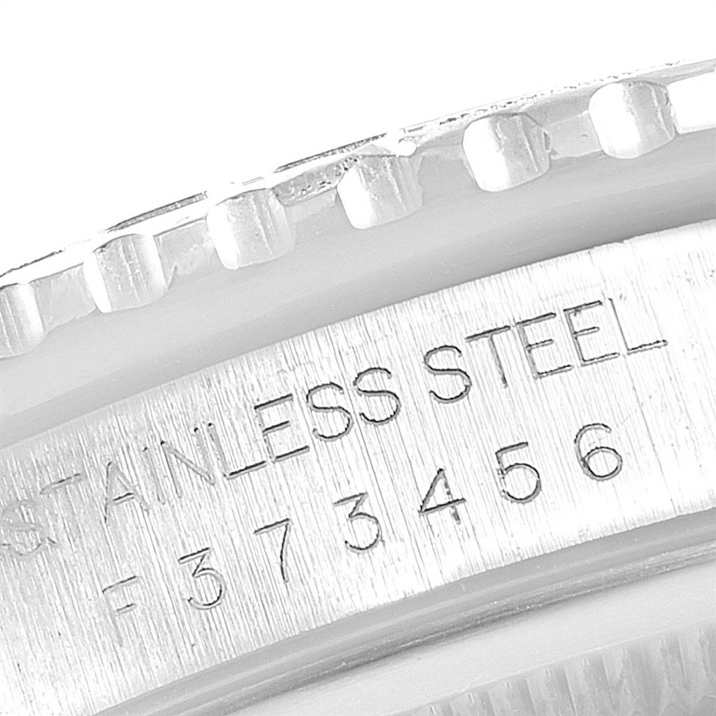 This close-up image shows the stainless steel bezel and engraving on a Rolex Turn-o-Graph 16264 Men's Stainless Steel Beige Dial 16264 Men's Stainless Steel Beige Dial watch.