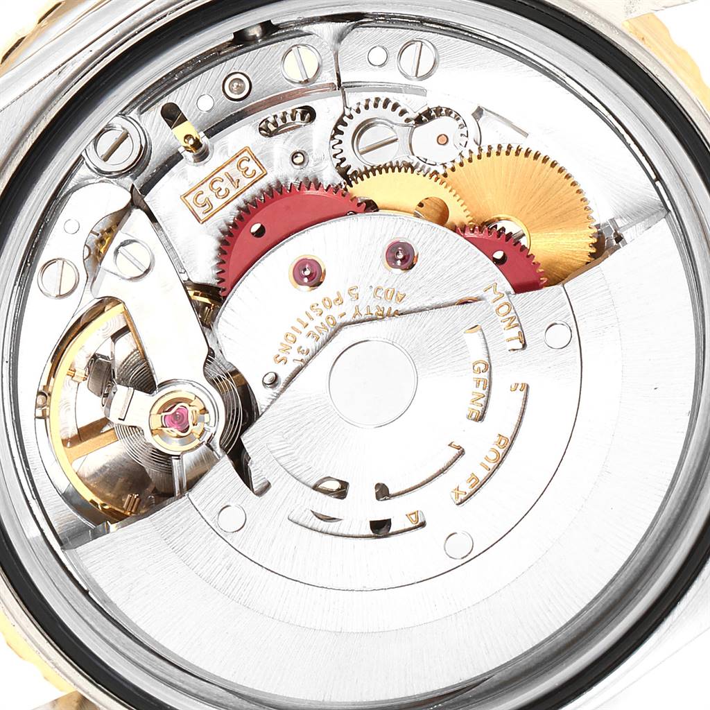 This is an image of the internal mechanism of a Rolex Turn-o-Graph 16263 Men
s Steel and Gold (two tone) Champagne Dial 16263 Men
s Steel and Gold (two tone) Champagne Dial watch, showing gears, springs, and other components.