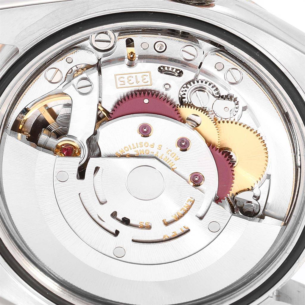 This image shows the internal mechanism of a Rolex Turn-o-Graph 116261 Men
s Steel and Gold (two tone) Black Dial 116261 Men
s Steel and Gold (two tone) Black Dial watch from a close-up angle.