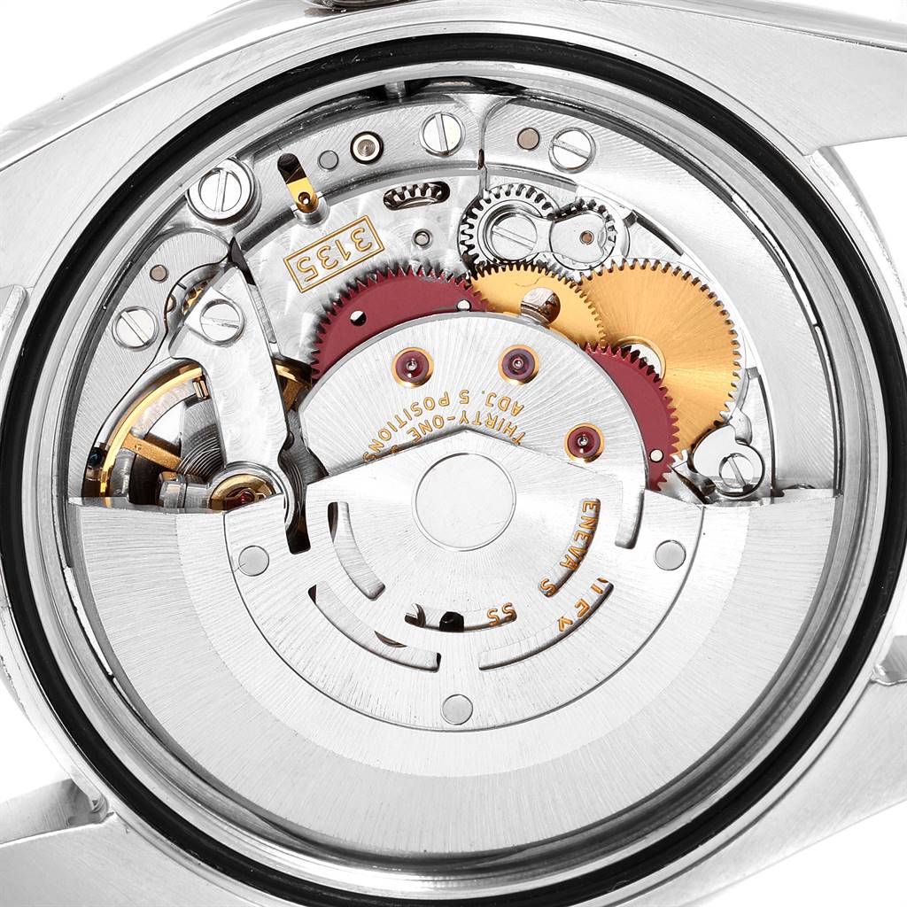 The image shows the intricate inner mechanics and movement of a Rolex Turn-o-Graph 116264 Men's Stainless Steel White Dial 116264 Men's Stainless Steel White Dial watch from a close-up angle.