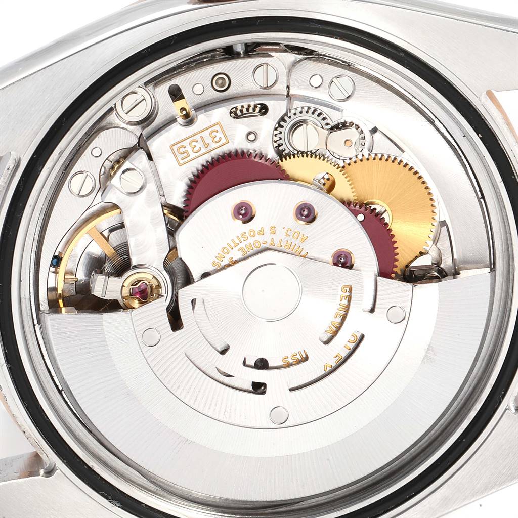 This is an internal view of the Rolex Turn-o-Graph 116261 Men's Stainless Steel Silver Dial 116261 Men's Stainless Steel Silver Dial watch, showcasing its intricate movement and gears.