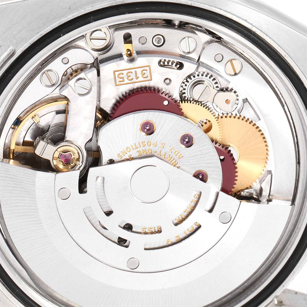 The image shows a close-up of the internal movement mechanism of the Rolex Turn-o-Graph 116263 Men's Stainless Steel Champagne Dial 116263 Men's Stainless Steel Champagne Dial model watch, featuring gears and components of the escapement system.