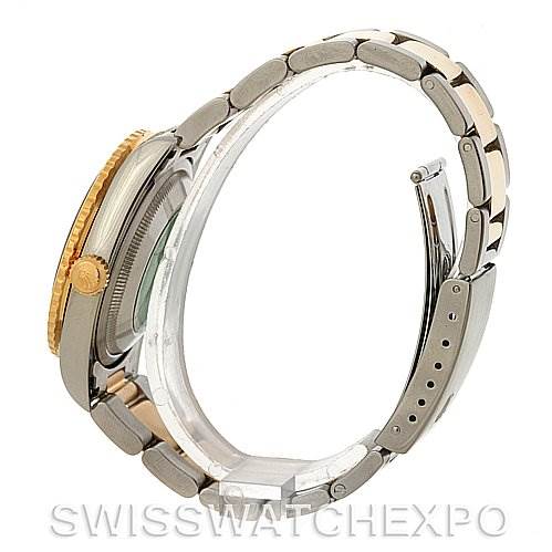 The image shows a side view of a Rolex Turn-o-Graph 16233 Men's Steel and Gold (two tone) Champagne Dial 16233 Men's Steel and Gold (two tone) Champagne Dial watch, focusing on the gold bezel, crown, and partially open bracelet.