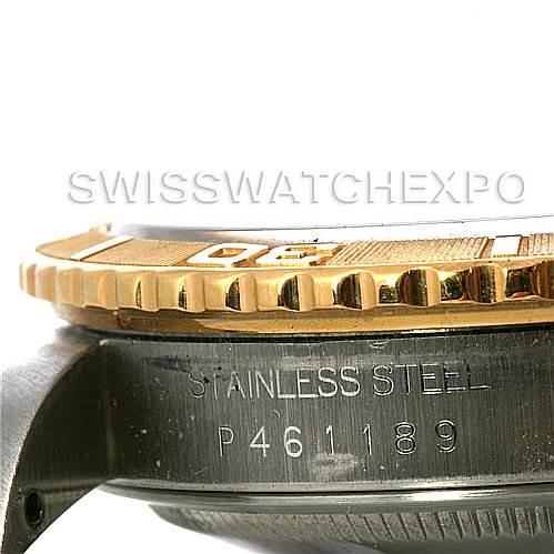 The image shows a side close-up of a Rolex Turn-o-Graph 16233 Men's Steel and Gold (two tone) Champagne Dial 16233 Men's Steel and Gold (two tone) Champagne Dial, highlighting the gold bezel and stainless steel case with the serial number.