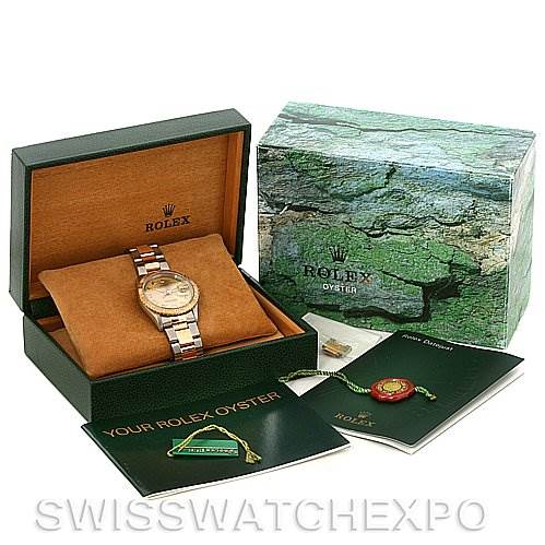 This image shows a Rolex Turn-o-Graph 16233 Men's Steel and Gold (two tone) Champagne Dial 16233 Men's Steel and Gold (two tone) Champagne Dial watch in its open box, along with manuals and a hang tag.