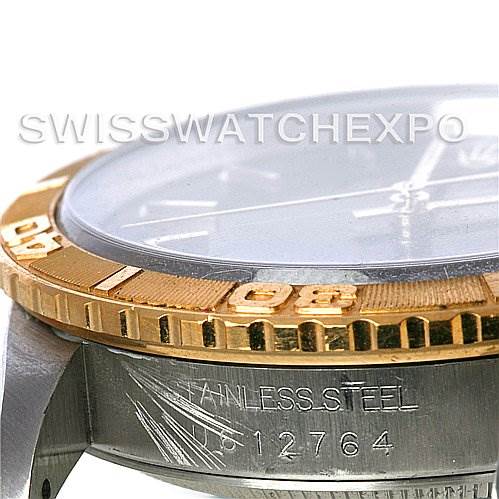 The image shows a side close-up of a Rolex Turn-o-Graph 16263 Men's Steel and Gold (two tone) Black Dial 16263 Men's Steel and Gold (two tone) Black Dial watch, focusing on the bezel and partially visible serial/identification number.