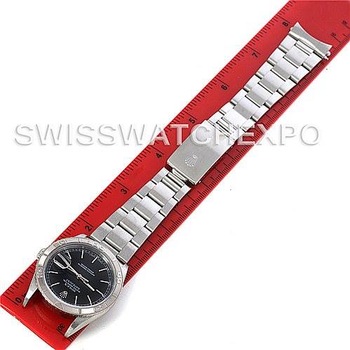 The Rolex Turn-o-Graph 16264 Men's Stainless Steel Black Dial 16264 Men's Stainless Steel Black Dial watch is shown fully extended and flat, placed on a red ruler for scale.