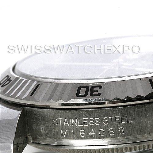 This image shows a close-up side view of the bezel and case of a Rolex Turn-o-Graph 116264 Men's Stainless Steel Black Dial 116264 Men's Stainless Steel Black Dial watch, highlighting its "Stainless Steel" and model number.