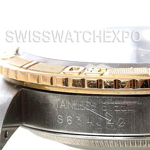 This image shows a close-up of the side of a Rolex Turn-o-Graph 16263 Men's Steel and Gold (two tone) Blue Dial 16263 Men's Steel and Gold (two tone) Blue Dial watch, highlighting the bezel, crystal, and stainless steel case with the serial number visible.