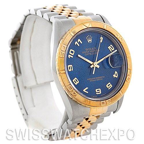 This image shows a Rolex Turn-o-Graph 16263 Men's Steel and Gold (two tone) Blue Dial 16263 Men's Steel and Gold (two tone) Blue Dial watch at a three-quarter angle, highlighting its blue dial, gold bezel, and two-tone bracelet.