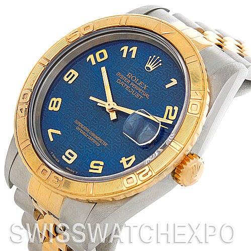 This side-angle view showcases the face, bezel, crown, and part of the bracelet of the Rolex Turn-o-Graph 16263 Men's Steel and Gold (two tone) Blue Dial 16263 Men's Steel and Gold (two tone) Blue Dial watch.