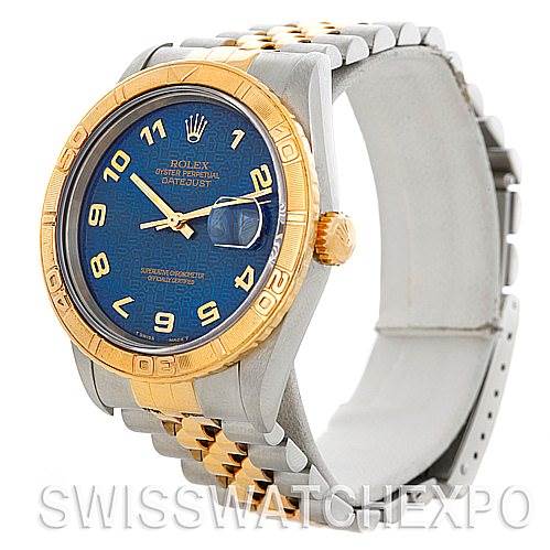 This image shows a Rolex Turn-o-Graph 16263 Men's Steel and Gold (two tone) Blue Dial 16263 Men's Steel and Gold (two tone) Blue Dial watch from an angled side perspective, highlighting its blue dial, gold bezel, and mixed metal bracelet.