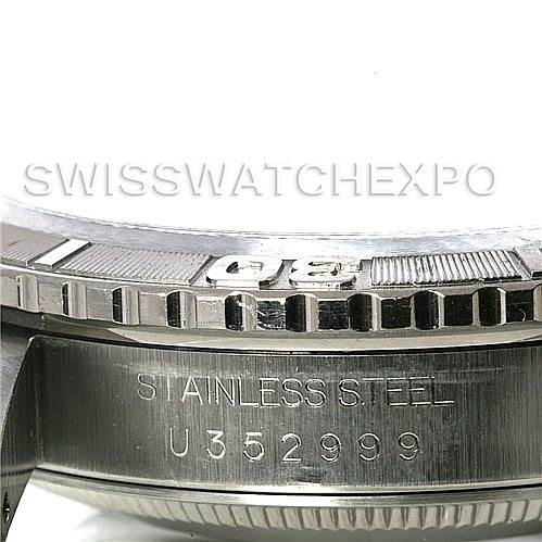 The image shows a close-up of the stainless steel bezel and casing of a Rolex Turn-o-Graph 16264 Men's Stainless Steel Silver Dial 16264 Men's Stainless Steel Silver Dial watch, including the serial number.