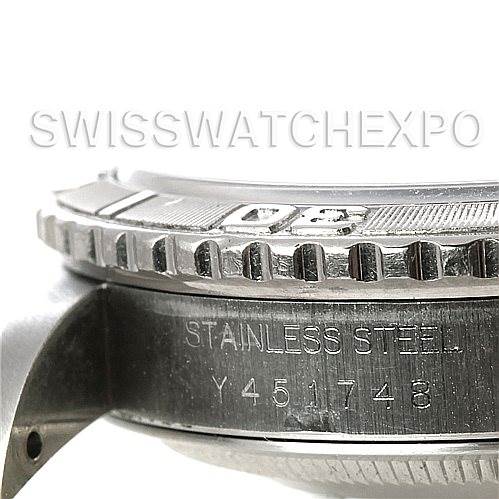 The image shows a side angle of the bezel and case of a Rolex Turn-o-Graph 16264 Men's Stainless Steel Silver Dial 16264 Men's Stainless Steel Silver Dial watch, highlighting the "Stainless Steel" engraving and serial number.