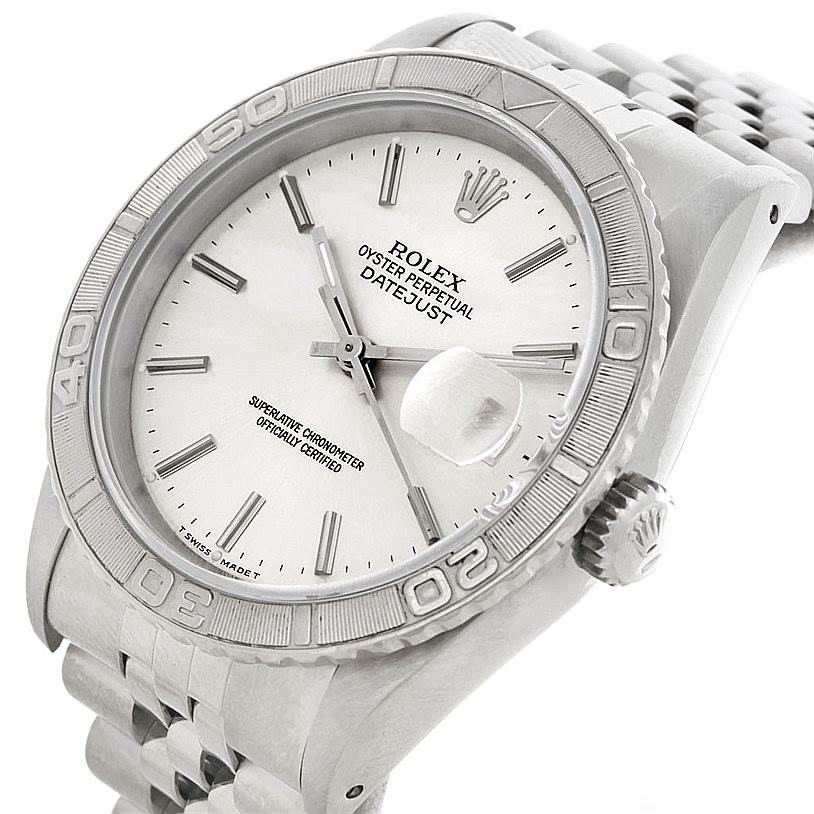 The image shows a Rolex Turn-o-Graph 16264 Men's Stainless Steel White Dial 16264 Men's Stainless Steel White Dial watch from a high-angle, showcasing the dial, bezel, case, and part of the bracelet.