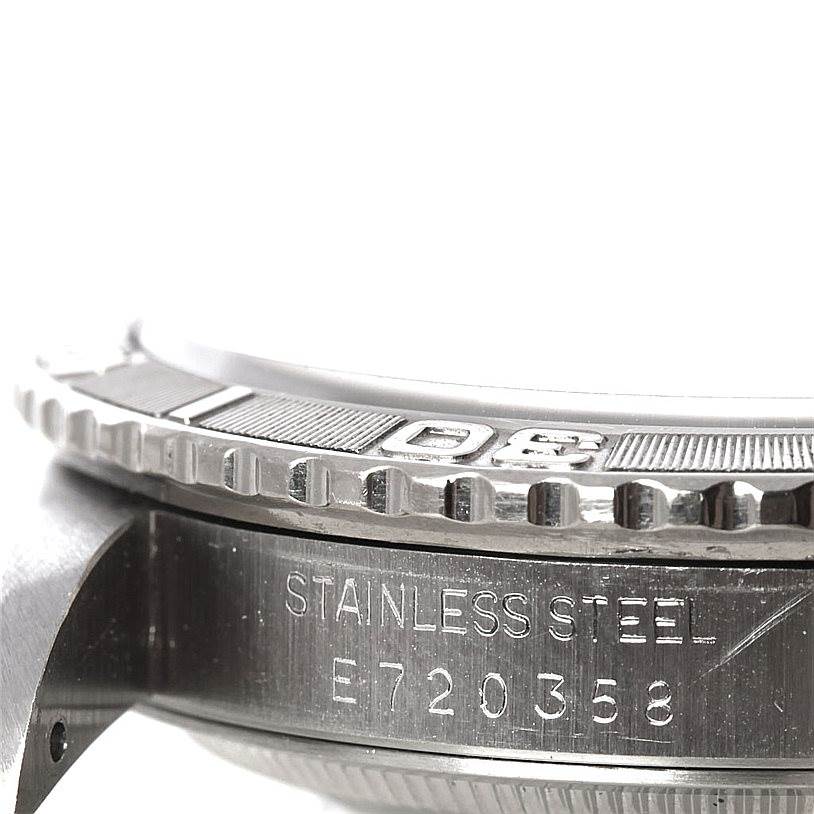 This image shows a side angle of the stainless steel case and bezel of a Rolex Turn-o-Graph 16264 Men's Stainless Steel White Dial 16264 Men's Stainless Steel White Dial watch, displaying its serial number.