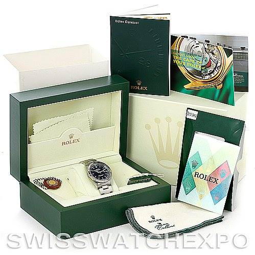 The image shows a Rolex Turn-o-Graph 16264 Men
s Stainless Steel Black Dial 16264 Men
s Stainless Steel Black Dial watch in its box with booklets and accessories, including a green tag and cleaning cloth.