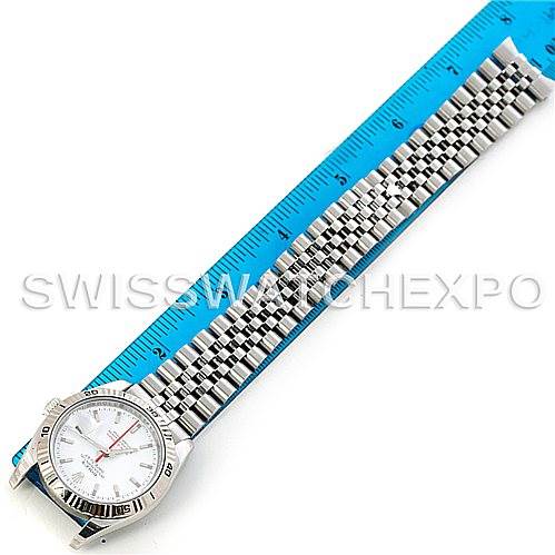 The image shows a Rolex Turn-o-Graph 116264 Men's Stainless Steel White Dial 116264 Men's Stainless Steel White Dial watch laid flat with its bracelet extended next to a blue ruler for size reference.