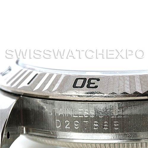 This close-up image of the Turn-o-Graph Rolex watch shows the details of the bezel and part of the case with engraving.