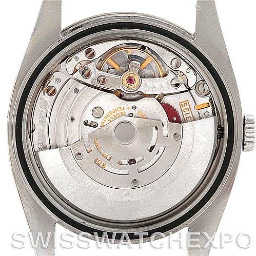 The image shows the Turn-o-Graph watch's interior movement by Rolex from a back view with the case back removed to display the mechanism.