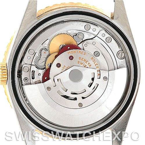 This image shows a back angle view of the Rolex Turn-o-Graph 16263 Men's Steel and Gold (two tone) Grey Dial 16263 Men's Steel and Gold (two tone) Grey Dial watch, displaying its internal mechanical movement and gears.