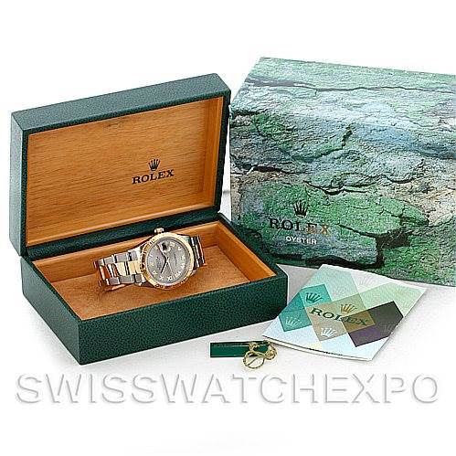 The image shows a Rolex Turn-o-Graph 16263 Men's Steel and Gold (two tone) Grey Dial 16263 Men's Steel and Gold (two tone) Grey Dial watch at a slight top-front angle, placed inside its box, along with an outer box, and accessories.