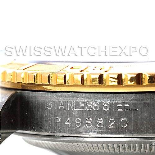 This image shows a close-up side view of the case and bezel of a Rolex Turn-o-Graph 16263 Men's Steel and Gold (two tone) Black Dial 16263 Men's Steel and Gold (two tone) Black Dial watch, highlighting its stainless steel material and serial number.