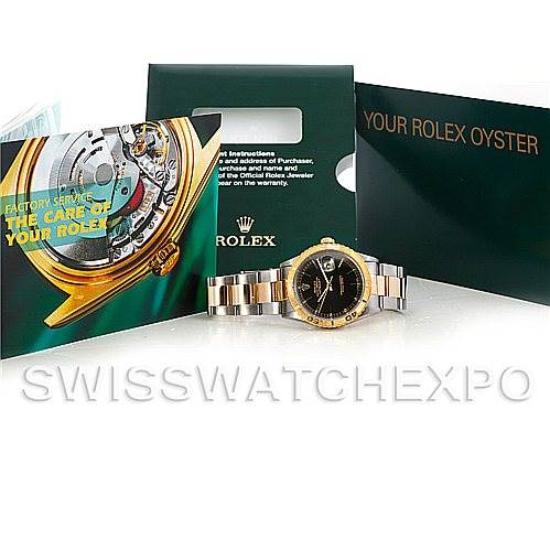 The Rolex Turn-o-Graph 16263 Men's Steel and Gold (two tone) Black Dial 16263 Men's Steel and Gold (two tone) Black Dial watch is shown from the front, accompanied by its box, booklet, and warranty card.