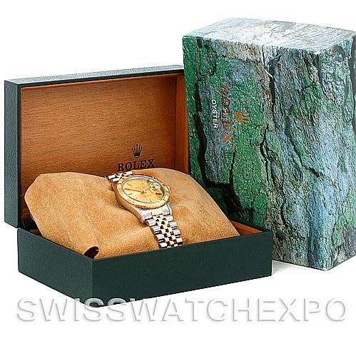 The Rolex Turn-o-Graph 16263 Men's Steel and Gold (two tone) Champagne Dial 16263 Men's Steel and Gold (two tone) Champagne Dial watch is shown in an open box, displaying the face, band, and part of the bezel at an angle.