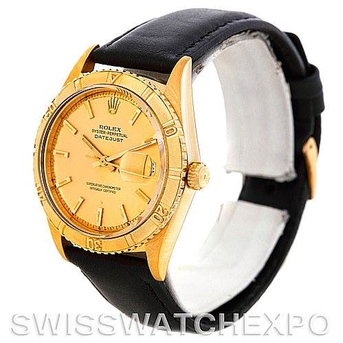 The image shows a Rolex Turn-o-Graph 1625 Men's Yellow Gold Champagne Dial 1625 Men's Yellow Gold Champagne Dial watch from an angled side view, displaying the dial, bezel, crown, and leather strap.