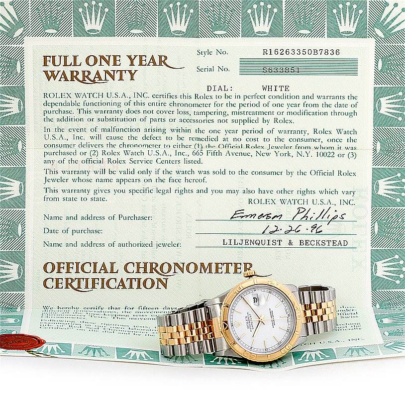 The image shows a Rolex Turn-o-Graph 16263 Men's Steel and Gold (two tone) White Dial 16263 Men's Steel and Gold (two tone) White Dial model watch laid flat on its warranty certificate.