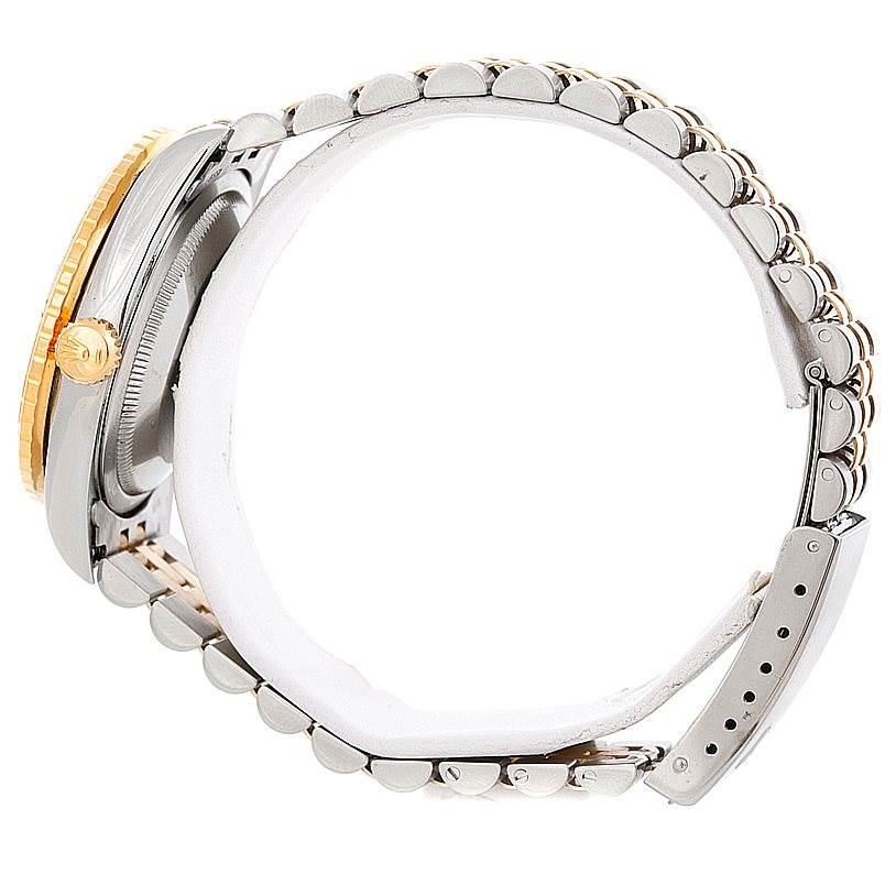 The Rolex Turn-o-Graph 16263 Men's Steel and Gold (two tone) White Dial 16263 Men's Steel and Gold (two tone) White Dial watch is shown from a side angle, highlighting the bezel, crown, and metal bracelet.