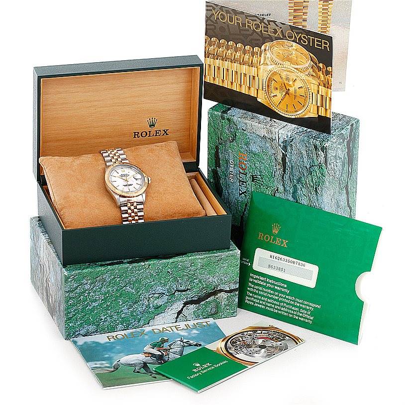 This image shows a Rolex Turn-o-Graph 16263 Men's Steel and Gold (two tone) White Dial 16263 Men's Steel and Gold (two tone) White Dial watch with its box, warranty card, and informational booklets from a slightly elevated angle.
