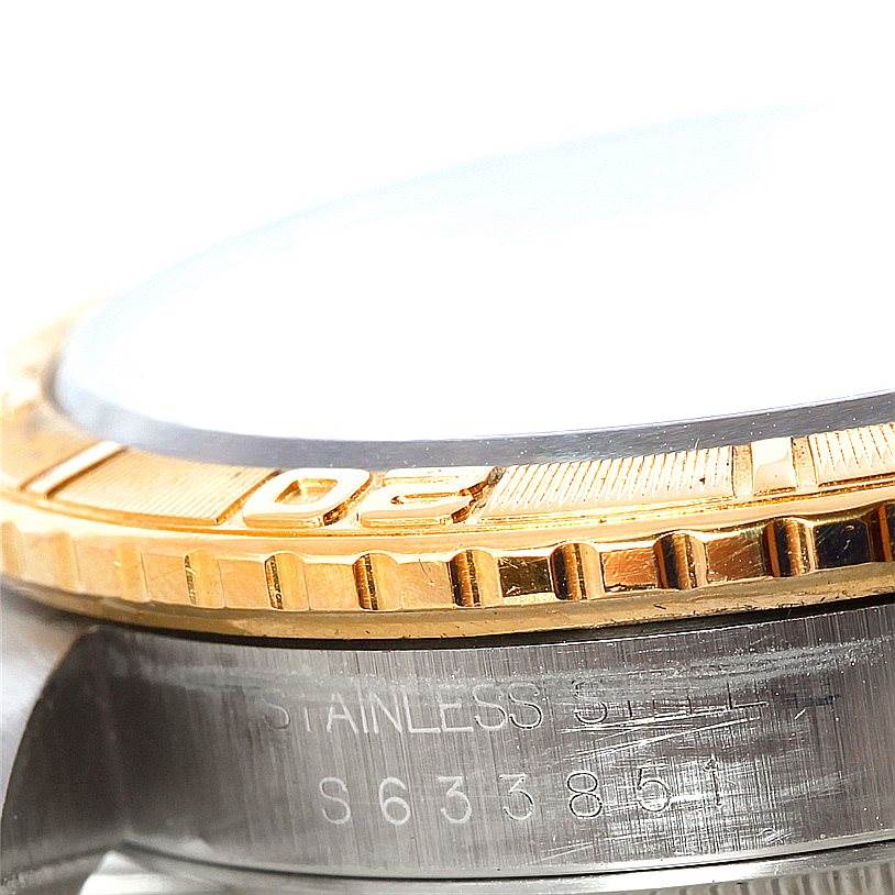 This image shows a close-up side view of the bezel and case of a Rolex Turn-o-Graph 16263 Men's Steel and Gold (two tone) White Dial 16263 Men's Steel and Gold (two tone) White Dial watch, highlighting its gold and stainless steel components.