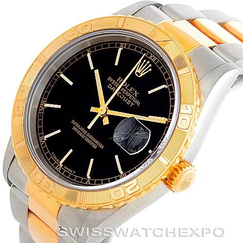 The image shows a Rolex Turn-o-Graph 16263 Men's Steel and Gold (two tone) Black Dial 16263 Men's Steel and Gold (two tone) Black Dial watch from an angle focusing on the watch face, bezel, and part of the bracelet.