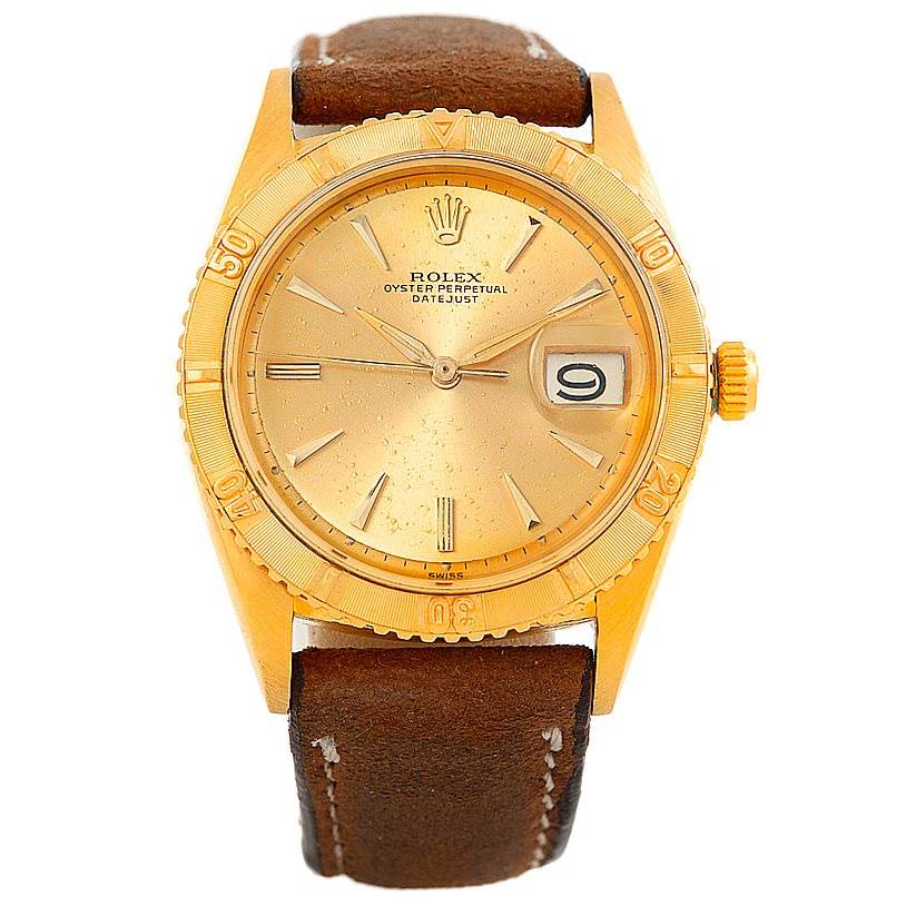 This image shows a front view of a Rolex Turn-o-Graph 1625 Men's Yellow Gold Champagne Dial 1625 Men's Yellow Gold Champagne Dial watch, featuring a gold case, rotating bezel, and brown leather strap.