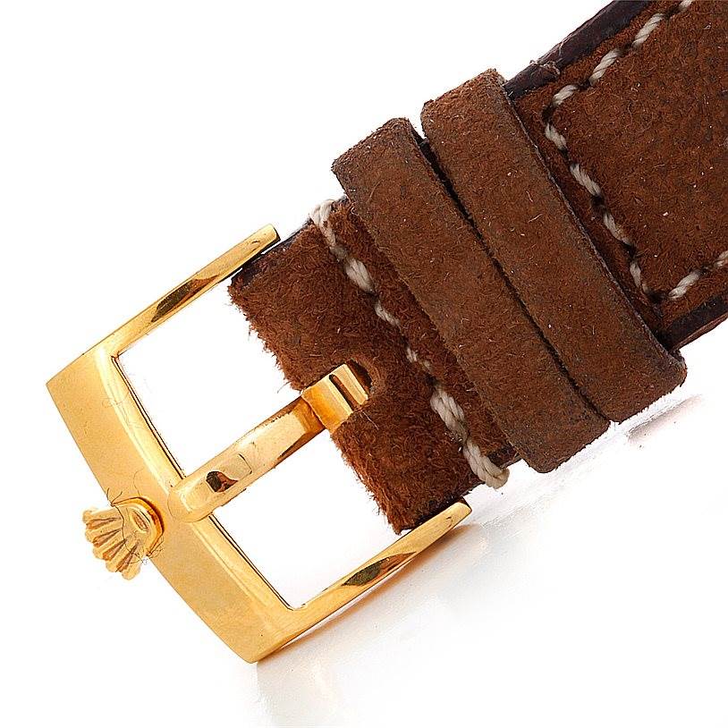 The image shows a close-up of the buckle and leather strap of a Rolex Turn-o-Graph 1625 Men's Yellow Gold Champagne Dial 1625 Men's Yellow Gold Champagne Dial watch.