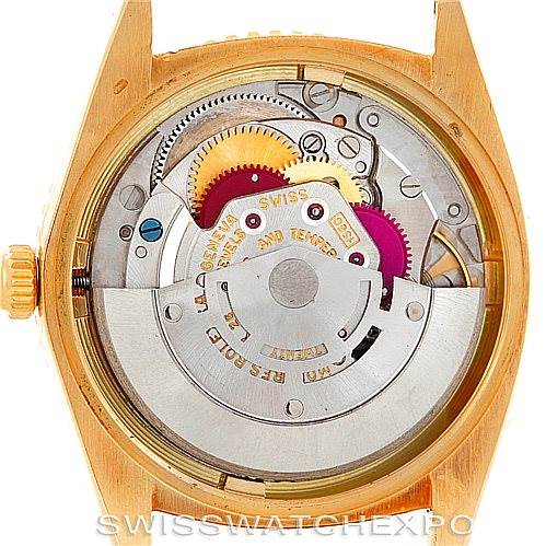 The image shows the back view of a Rolex Turn-o-Graph 1625 Men's Yellow Gold Champagne Dial 1625 Men's Yellow Gold Champagne Dial watch, displaying its internal mechanics with various gears and the movement.