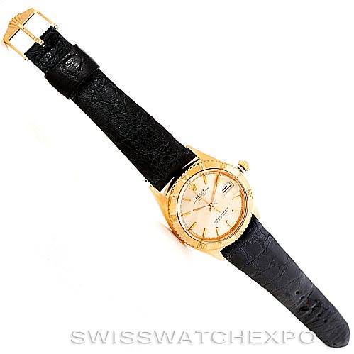 This image shows a Rolex Turn-o-Graph 1625 Men's Yellow Gold Champagne Dial 1625 Men's Yellow Gold Champagne Dial watch with a leather strap, displayed at an angled top-down view.