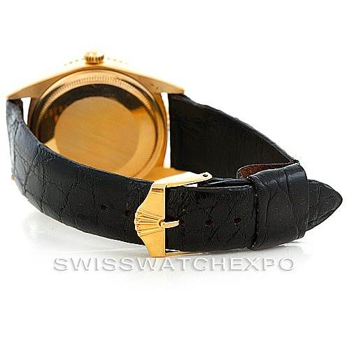 The image shows a Rolex Turn-o-Graph 1625 Men's Yellow Gold Champagne Dial 1625 Men's Yellow Gold Champagne Dial watch from the back, highlighting its leather strap and buckle.