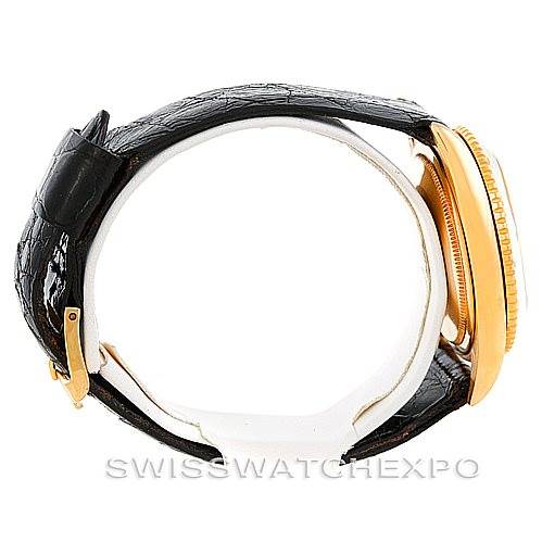 This image shows a side view of the Rolex Turn-o-Graph 1625 Men's Yellow Gold Champagne Dial 1625 Men's Yellow Gold Champagne Dial watch, highlighting its black leather strap and gold case.