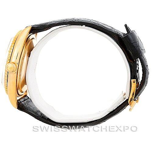 The image shows a side view of the Rolex Turn-o-Graph 1625 Men's Yellow Gold Champagne Dial 1625 Men's Yellow Gold Champagne Dial watch, highlighting its gold case and black leather strap.