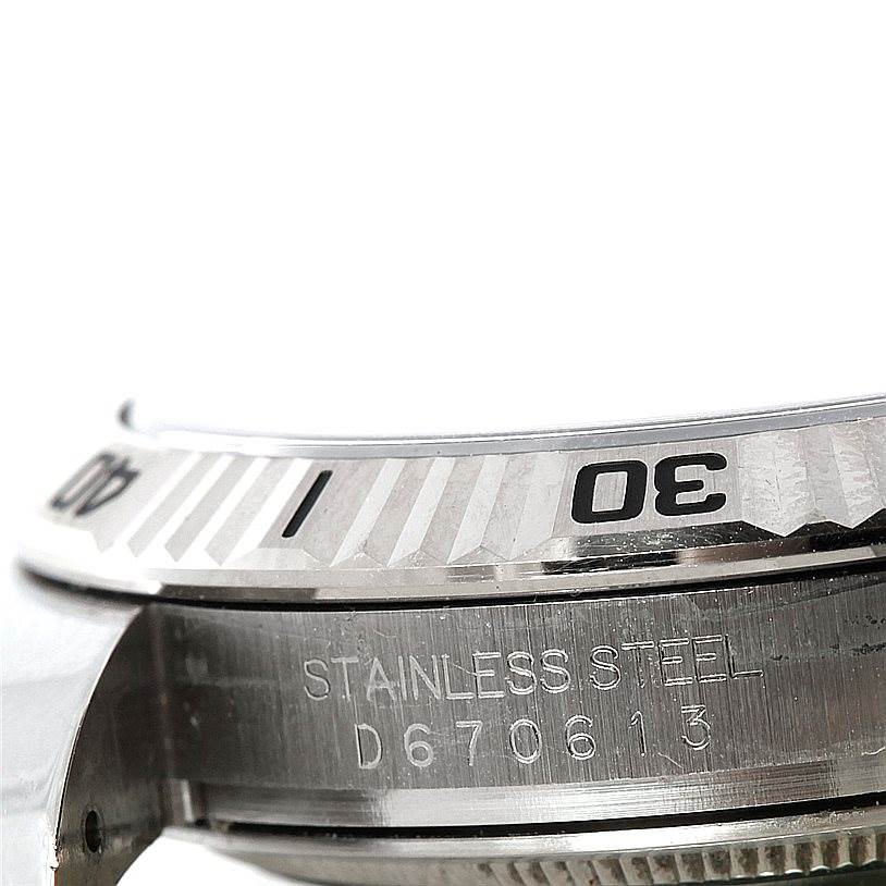 This image shows a close-up of the bezel and part of the case back of a Rolex Turn-o-Graph 116264 Men's Stainless Steel White Dial 116264 Men's Stainless Steel White Dial watch.